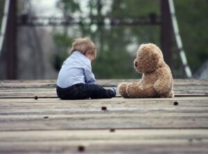 a baby with a teddy bear