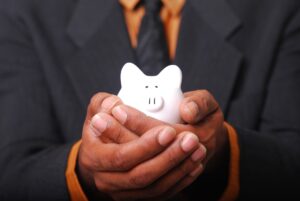 a man holding piggy bank