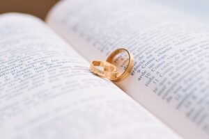 wedding rings on a book